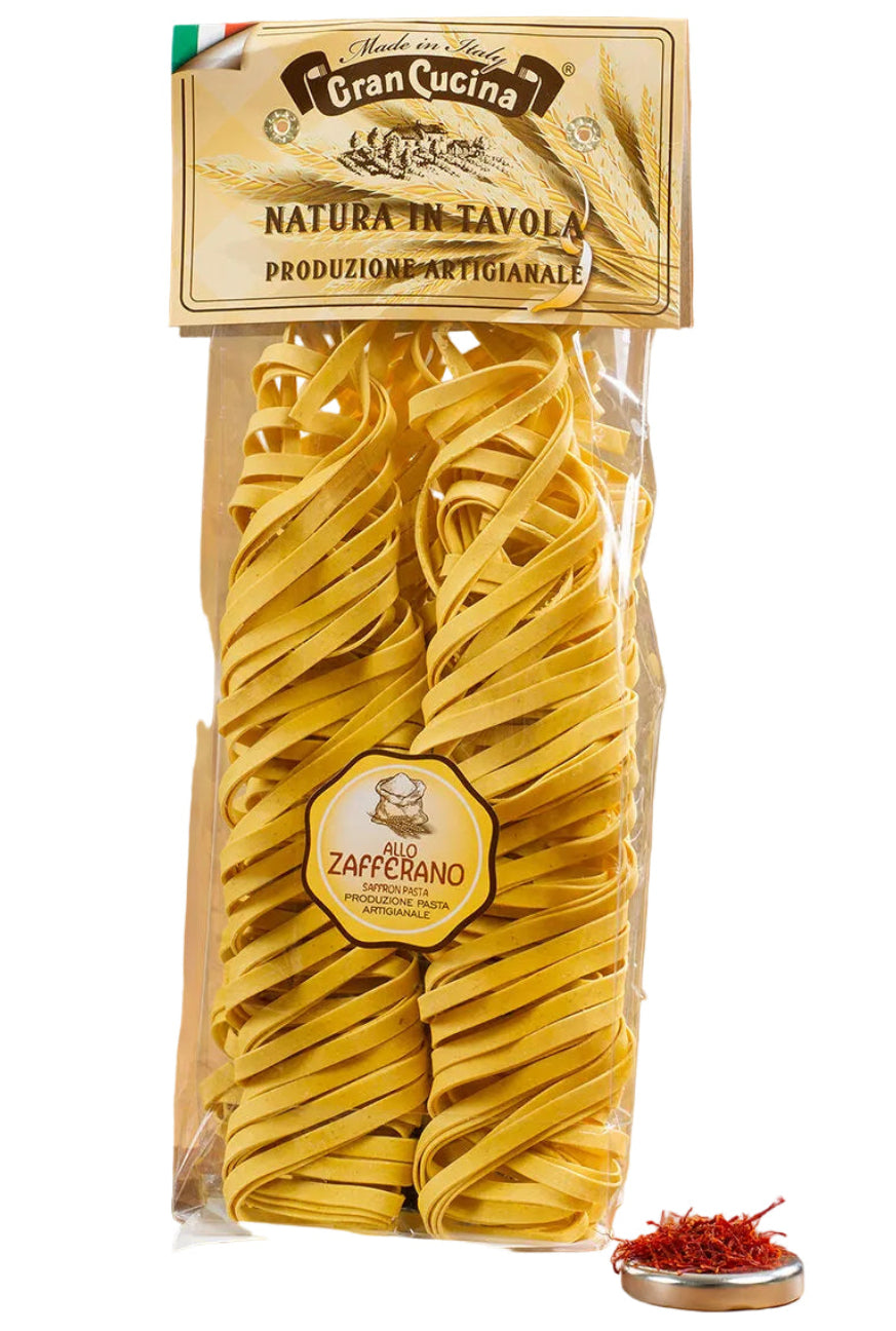 Packaged pasta with Gran Cucina branding on a wooden surface