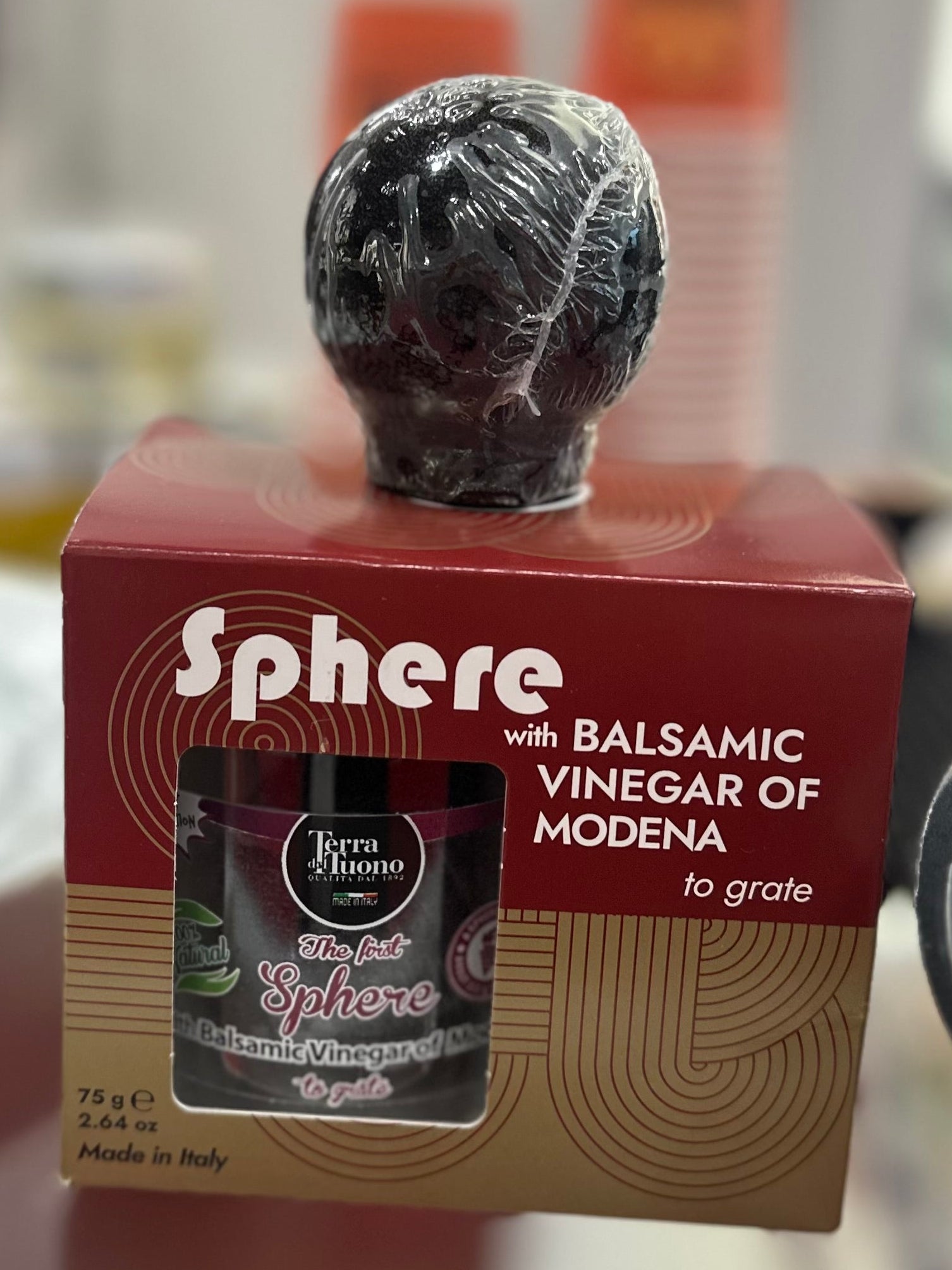 Box of Sphere Balsamic Vinegar of Modena on a table with blurred background