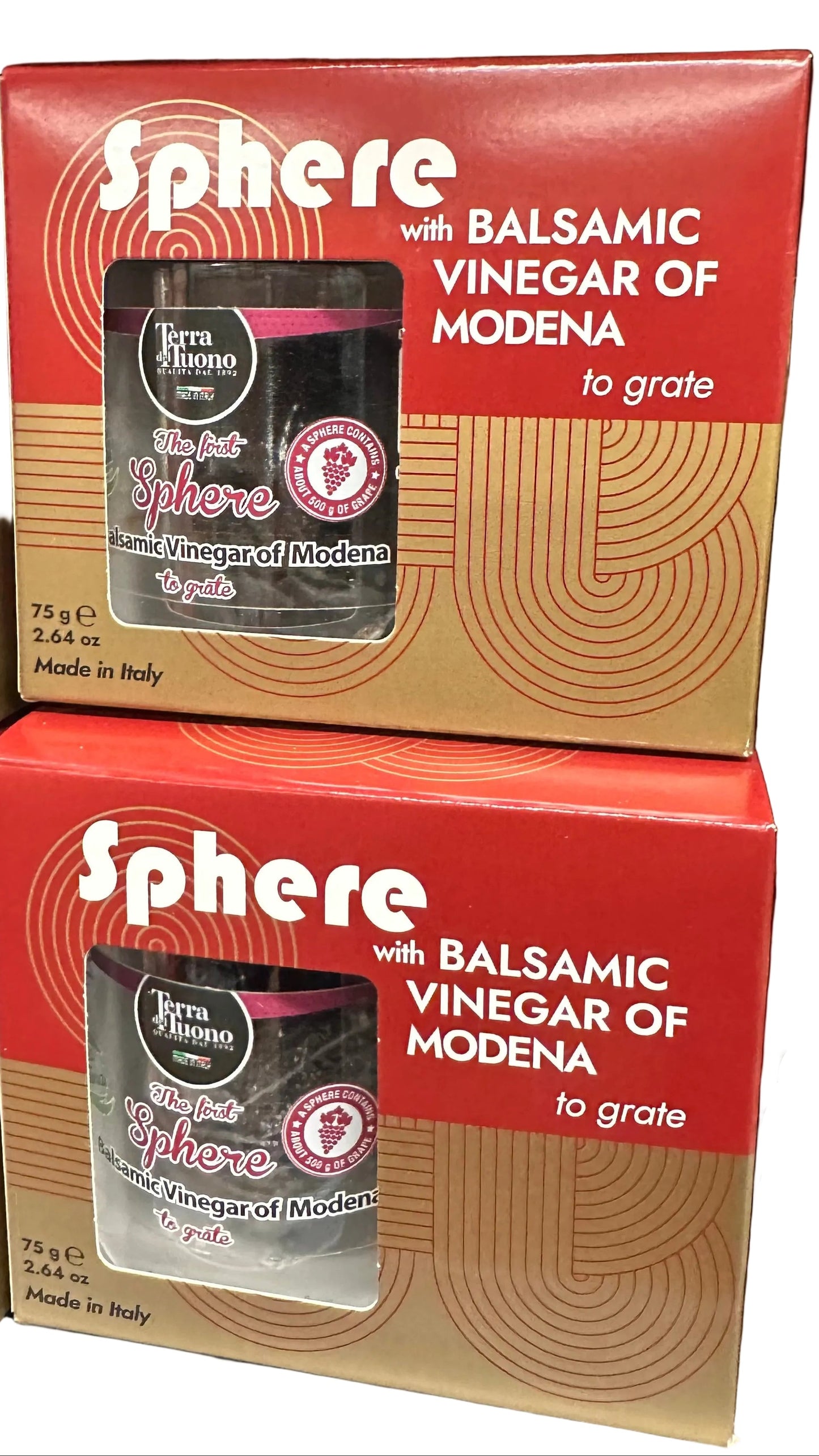 Two boxes of Sphere with Balsamic Vinegar of Modena on a dark background